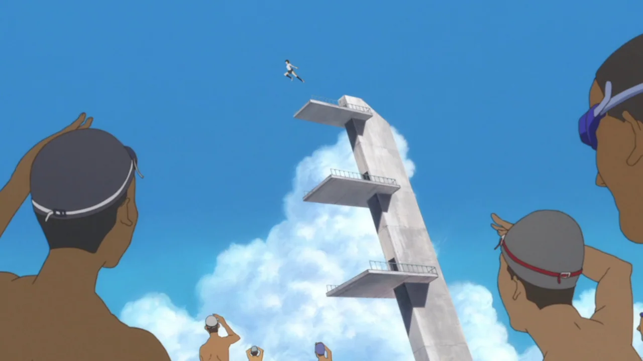 The Girl Who Leapt Through Time (2006) movie still: wide — A tall concrete diving tower stands against a vast blue sky with fluffy clouds. A small…