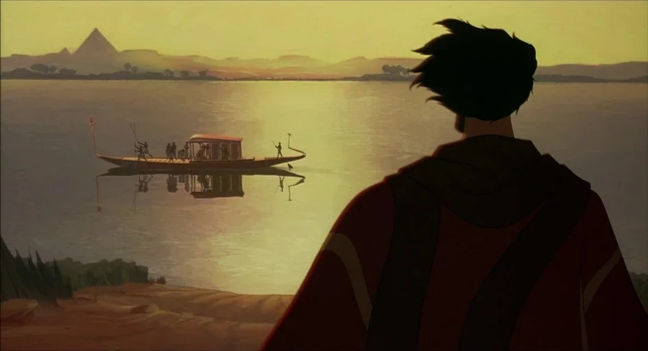 The Prince of Egypt (1998) movie still: medium — An ancient riverbank overlooks a calm expanse of water with a distant pyramid silhouette. A man…