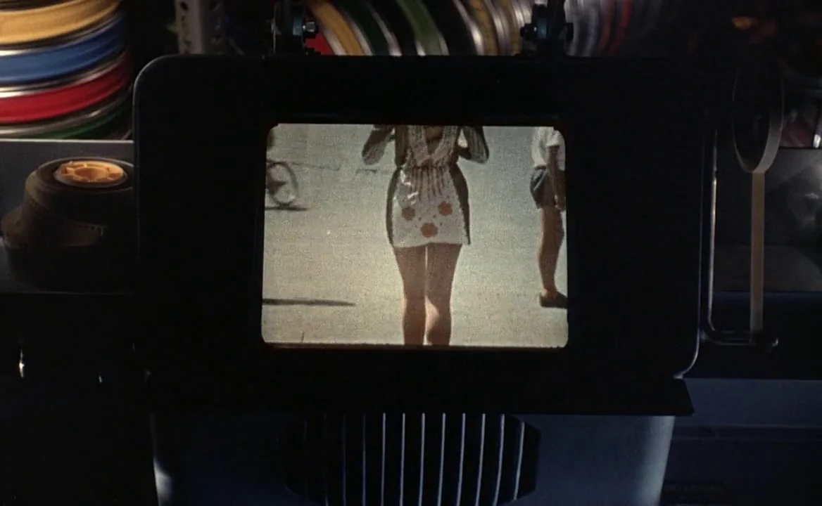 F for Fake (1973) movie still: closeup — A film editing viewer displays an old, grainy recording on its small screen. The projected image shows a…