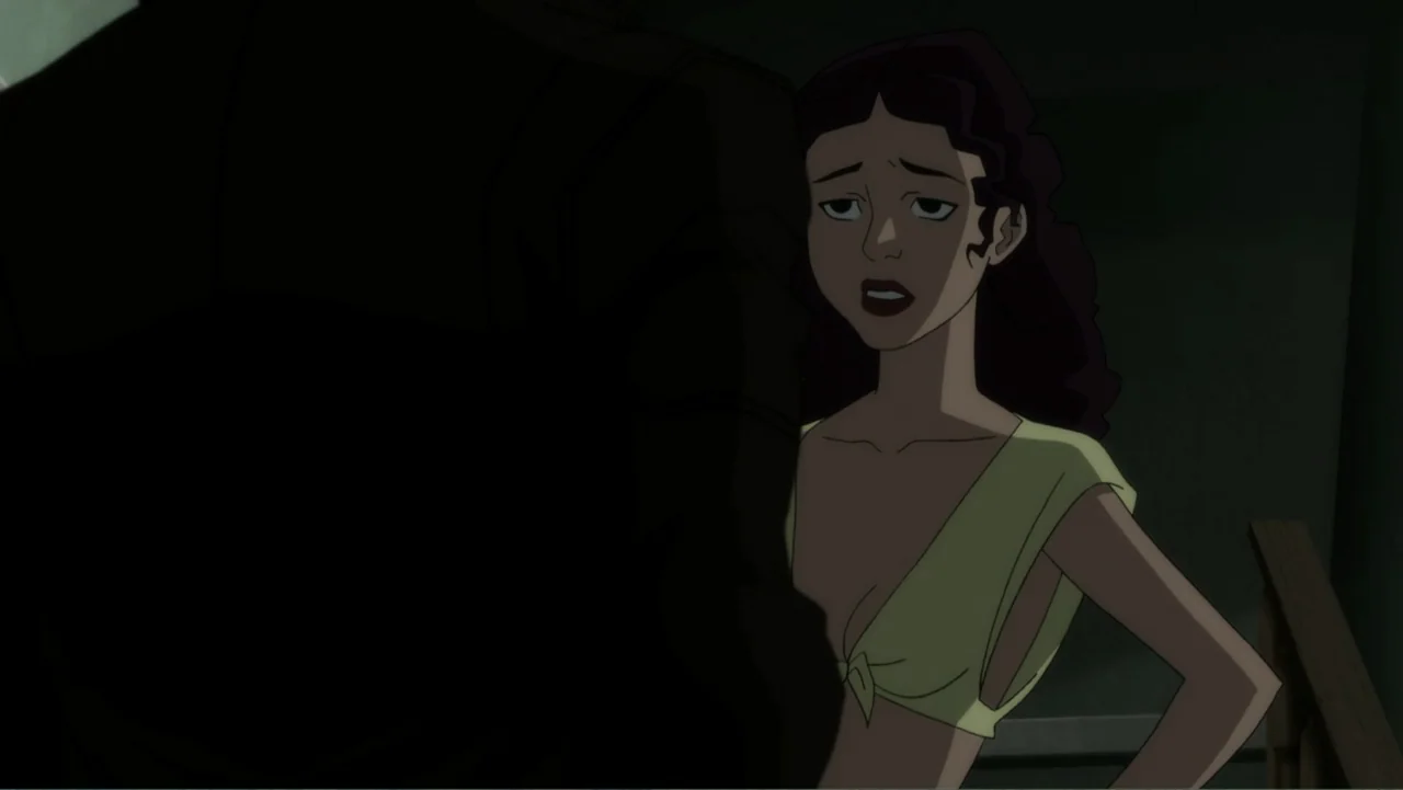 Suicide Squad: Hell to Pay (2018) movie still: medium — A dimly lit indoor stairwell features dark walls and wooden railing structures. A young…
