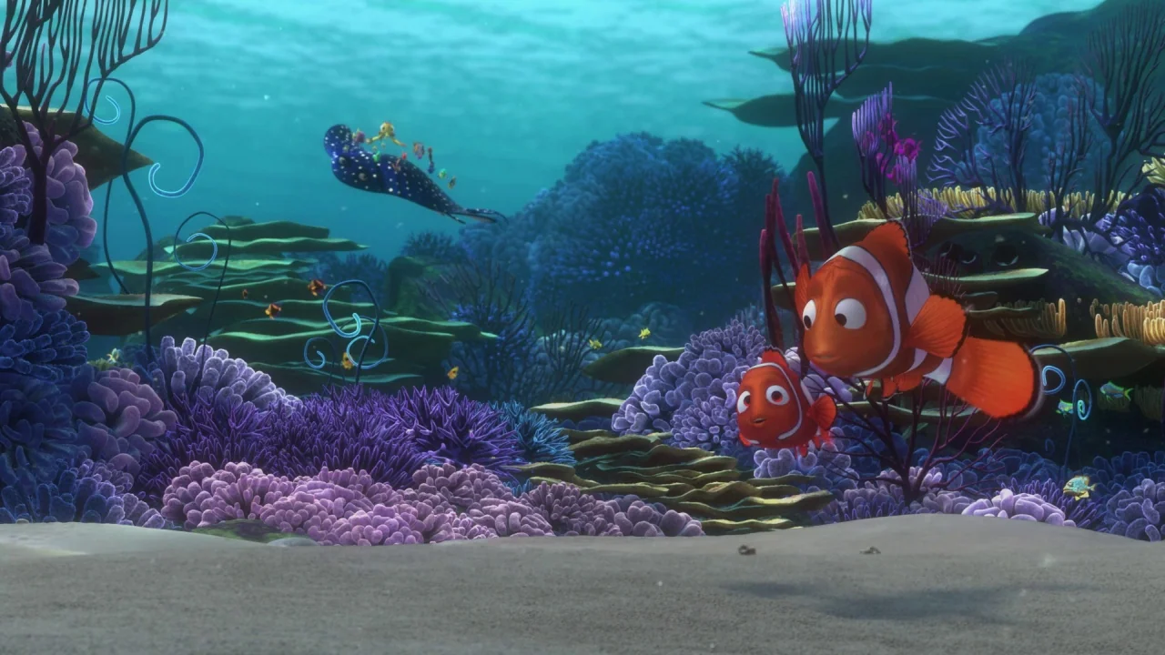 Finding Nemo (2003) movie still: wide — A vibrant underwater coral reef featuring diverse purple and blue textures under shallow water. Two orange…