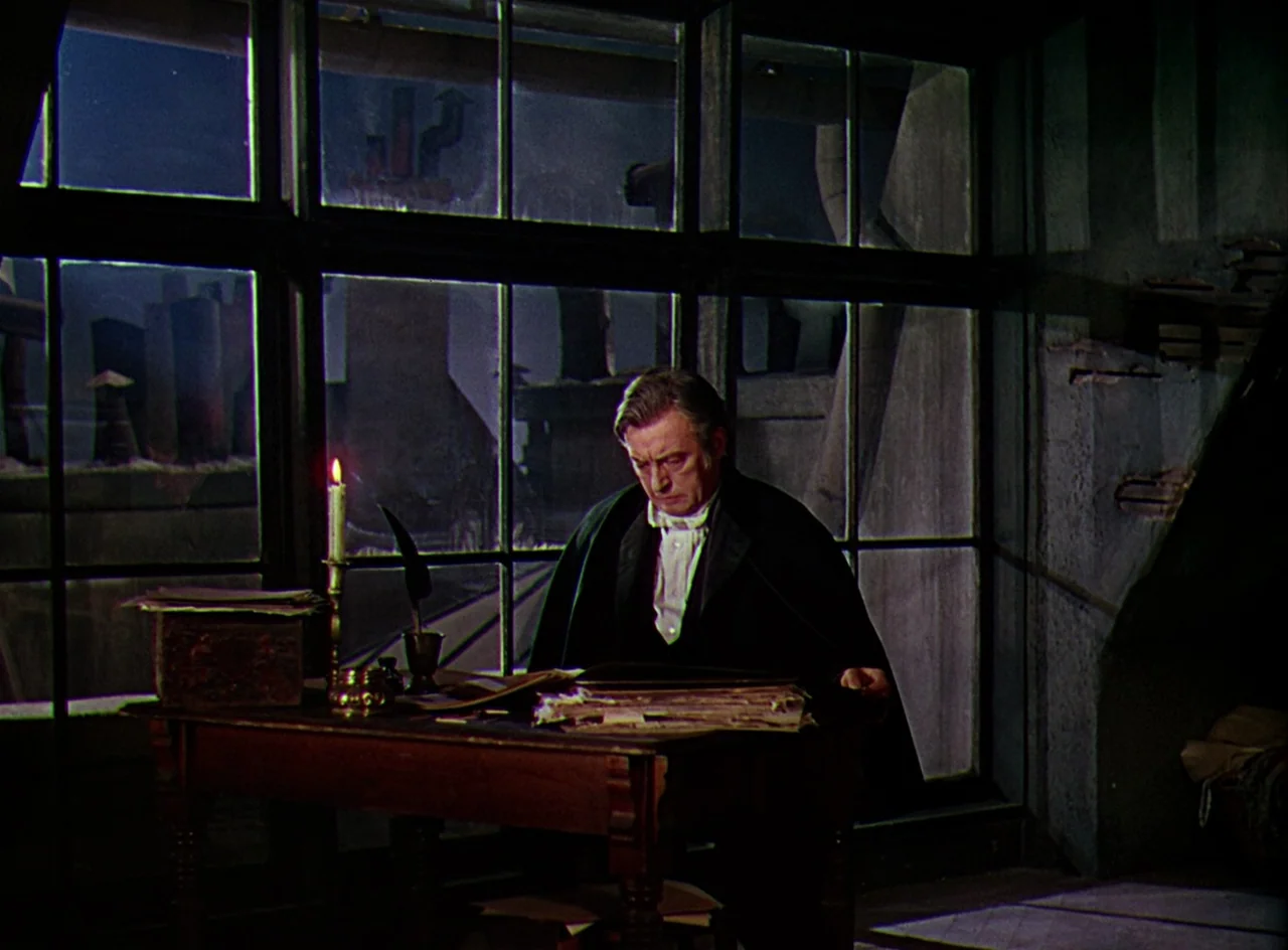 Phantom of the Opera (1943) movie still: medium — A dimly lit room features a large paneled window overlooking a dark, industrial city at night. A…