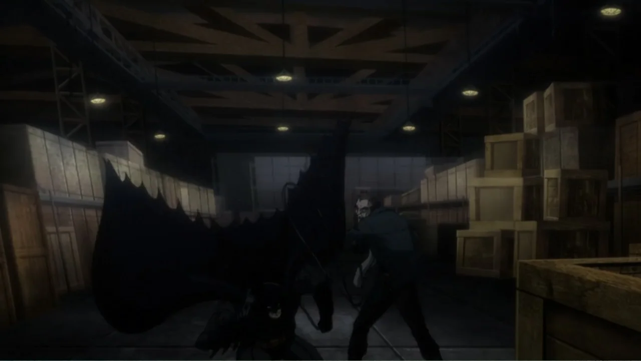 Batman: Assault on Arkham (2014) movie still: wide — A dimly lit industrial space features stacked wooden crates beneath low-hanging light fixtures.…