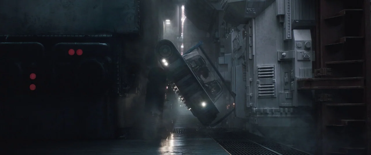 Solo: A Star Wars Story (2018) movie still: wide — A narrow industrial passage features stark white metallic walls and dark, smoke-filled shadowed…