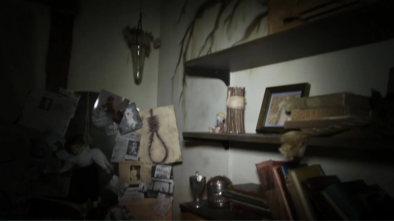 The Gallows (2015) movie still: wide — A dimly lit room contains wooden shelves laden with various books and personal artifacts. Paper clippings…