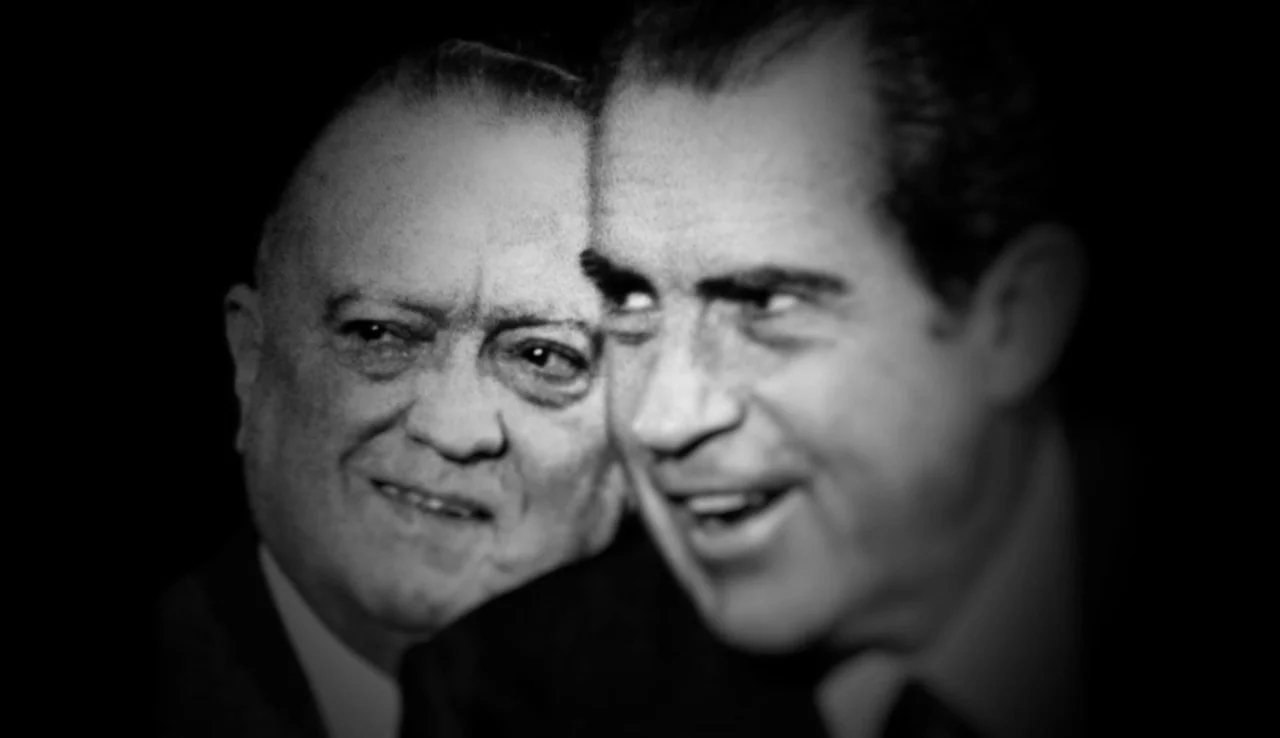 13th (2016) movie still: closeup — A split-screen or double exposure effect features two men in black and white. The older man sits on the left…