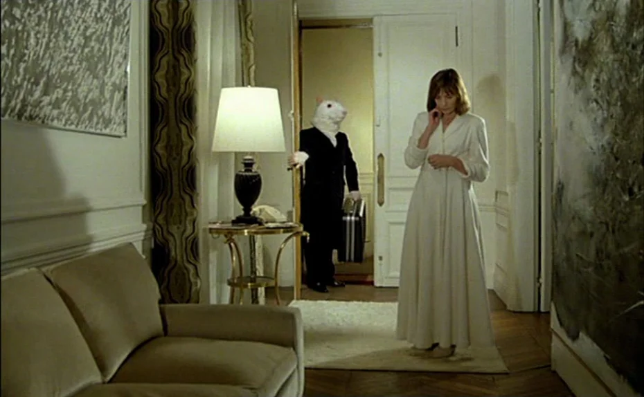 My American Uncle (Mon oncle d’Amérique) (1980) movie still: fullbody — An upscale apartment interior with white walls and abstract art pieces. A…