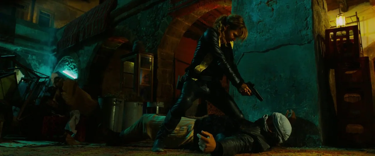 John Wick: Chapter 3 – Parabellum (2019) movie still: fullbody — A stone-walled basement with vaulted arches and rough masonry illuminated by…