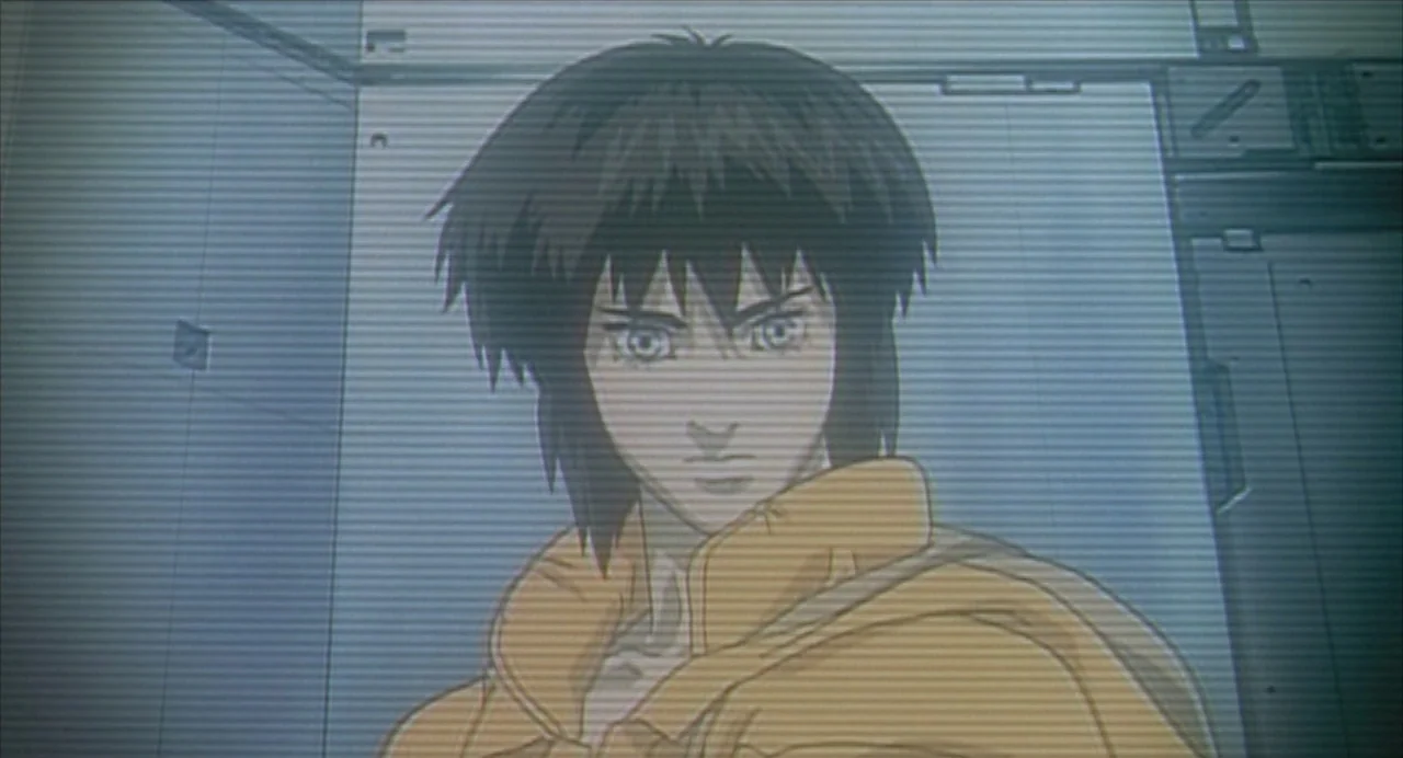 Ghost in the Shell (1995) movie still: closeup — The frame depicts a futuristic, sterile metallic environment with panelled walls. A young woman in…