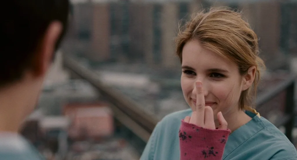 It’s Kind Of A Funny Story (2010) movie still: medium — A high-rise rooftop overlooks a blurred city environment with grey building textures. A…