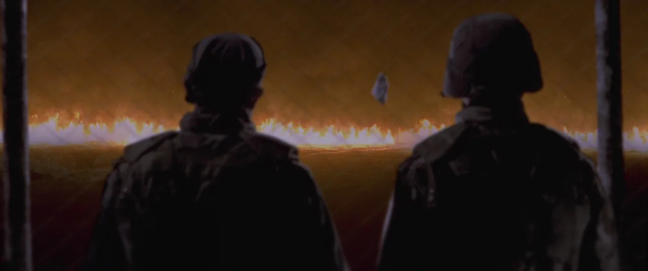 Joint Security Area (2000) movie still: medium — Two figures in dark military uniforms stand in front of a chain link fence. They observe a distant,…