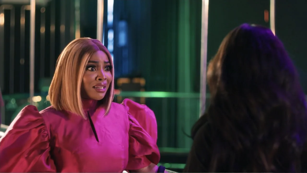 SIN: Blackout (2025) movie still: medium — A modern interior space features sleek metallic accents and colored architectural lighting elements. A…