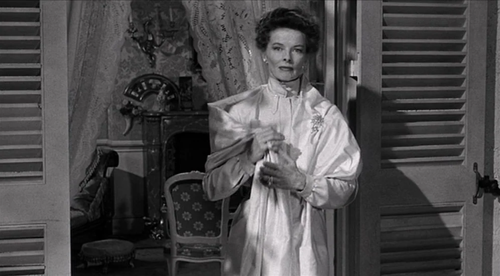 Suddenly, Last Summer (1959) movie still: medium — A refined interior with shuttered doors and ornate Victorian-style furniture in the background. A…