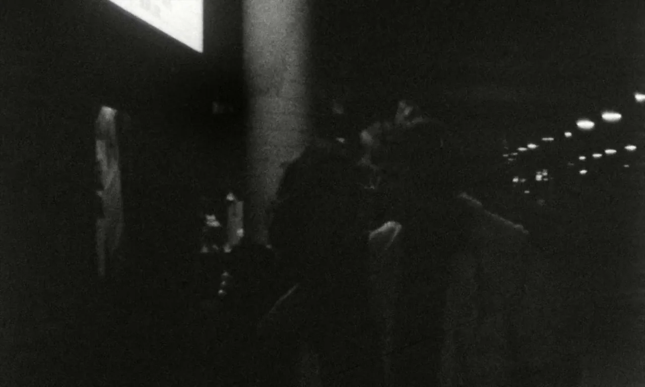 The Lost Honour of Katharina Blum (1975) movie still: medium — A dimly lit train station platform at night with blurred lights in the background.…