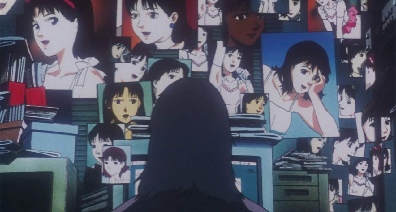 Perfect Blue (1997) movie still: medium — A cluttered interior space features walls covered in numerous posters and photographs of a woman. A person…