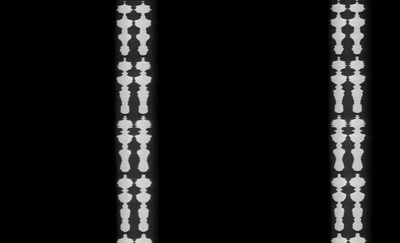 Faster, Pussycat! Kill! Kill! (1965) movie still: establishing — Two identical vertical columns of repeated, ornate white abstract shapes appear on…