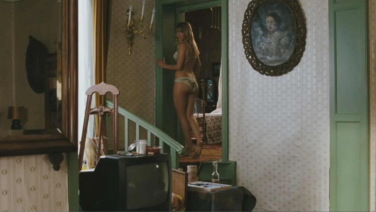 Deuce Bigalow: European Gigolo (2005) movie still: fullbody — A residential interior features floral wallpaper, a green door frame, and an oval…