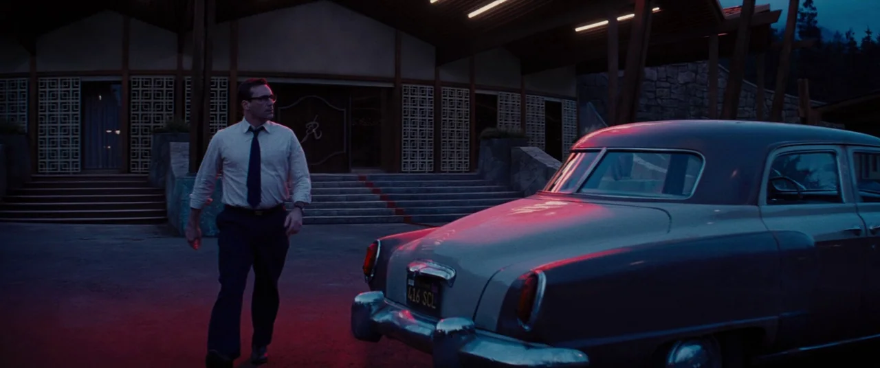 Bad Times at the El Royale (2018) movie still: fullbody — A 1960s roadside building with geometric screen blocks and a sweeping roof line at night.…