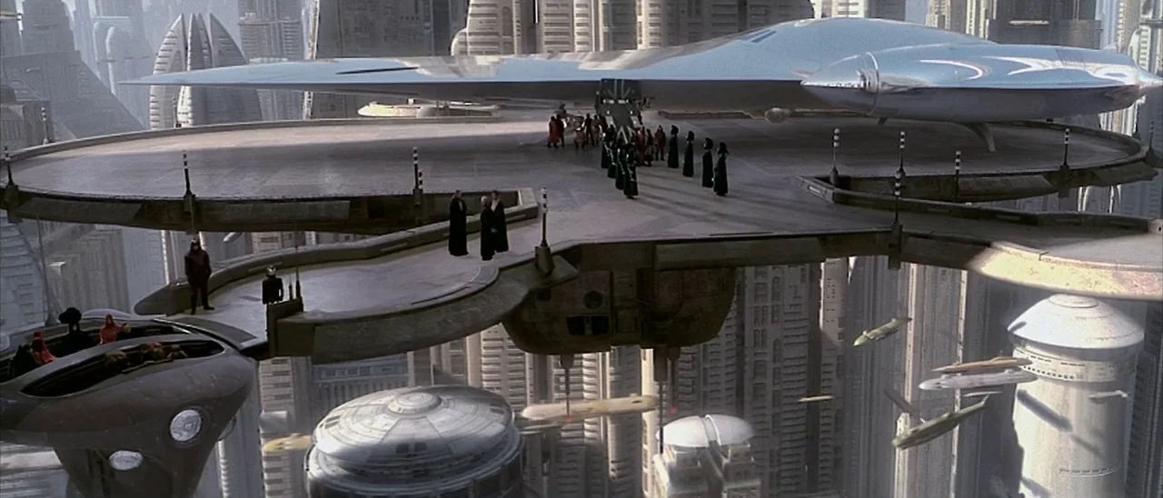 Star Wars: Episode I – The Phantom Menace (1999) movie still: wide — A high-altitude landing platform extends from a massive city of uniform,…