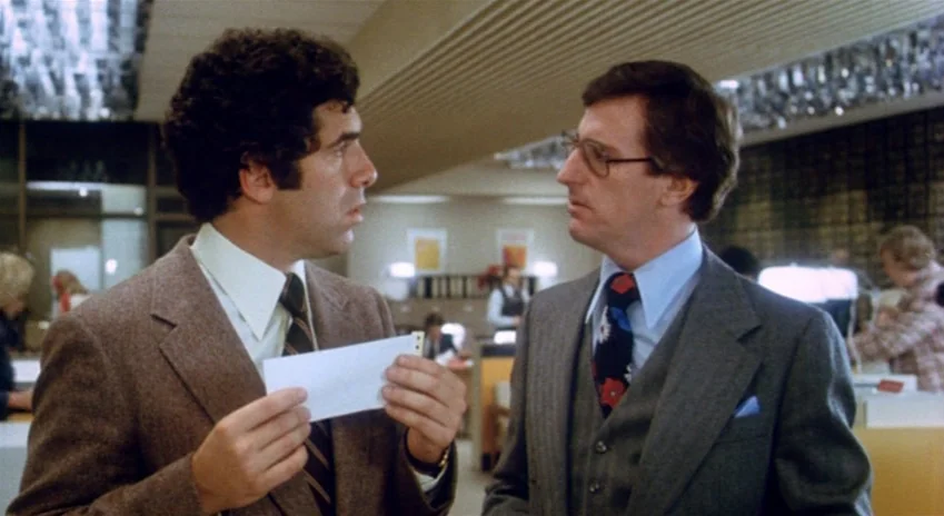 The Silent Partner (1978) movie still: medium — A busy commercial office space features drop ceilings and cubicles populated by clerical workers.…