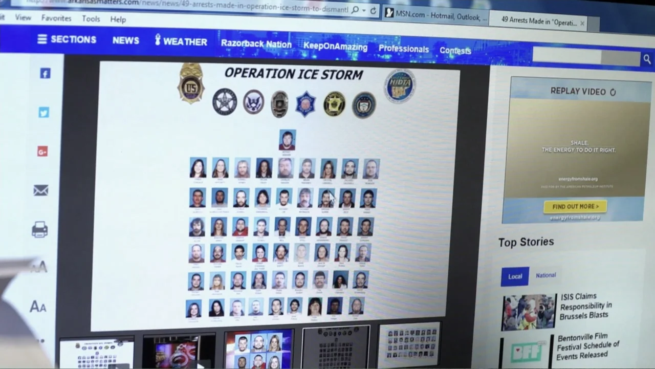 Meth Storm (2017) movie still: closeup — A computer screen shows a web browser displaying a news article about a criminal investigation. The webpage…