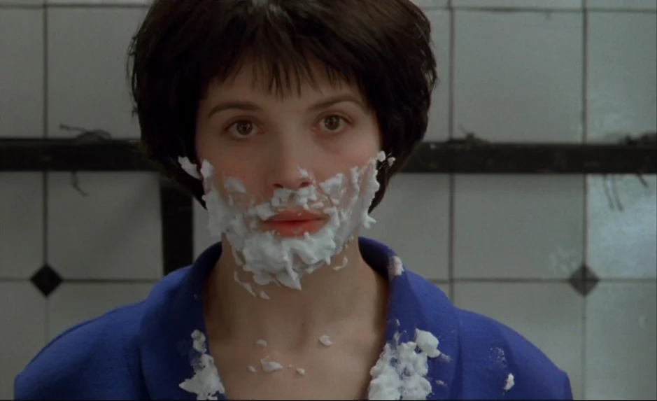 Mauvais Sang (Bad Blood) (The Night Is Young) (1986) movie still: closeup — A tiled bathroom wall forms the background behind the subject. The…