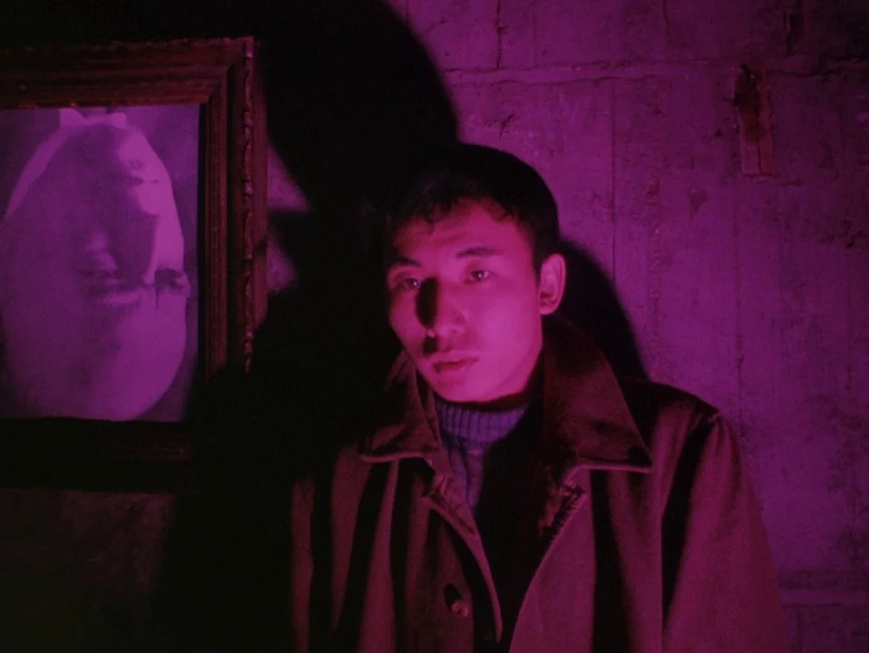 Throw Away Your Books, Rally in the Streets (1971) movie still: medium — A dark space with a textured concrete wall lit in intense magenta neon…
