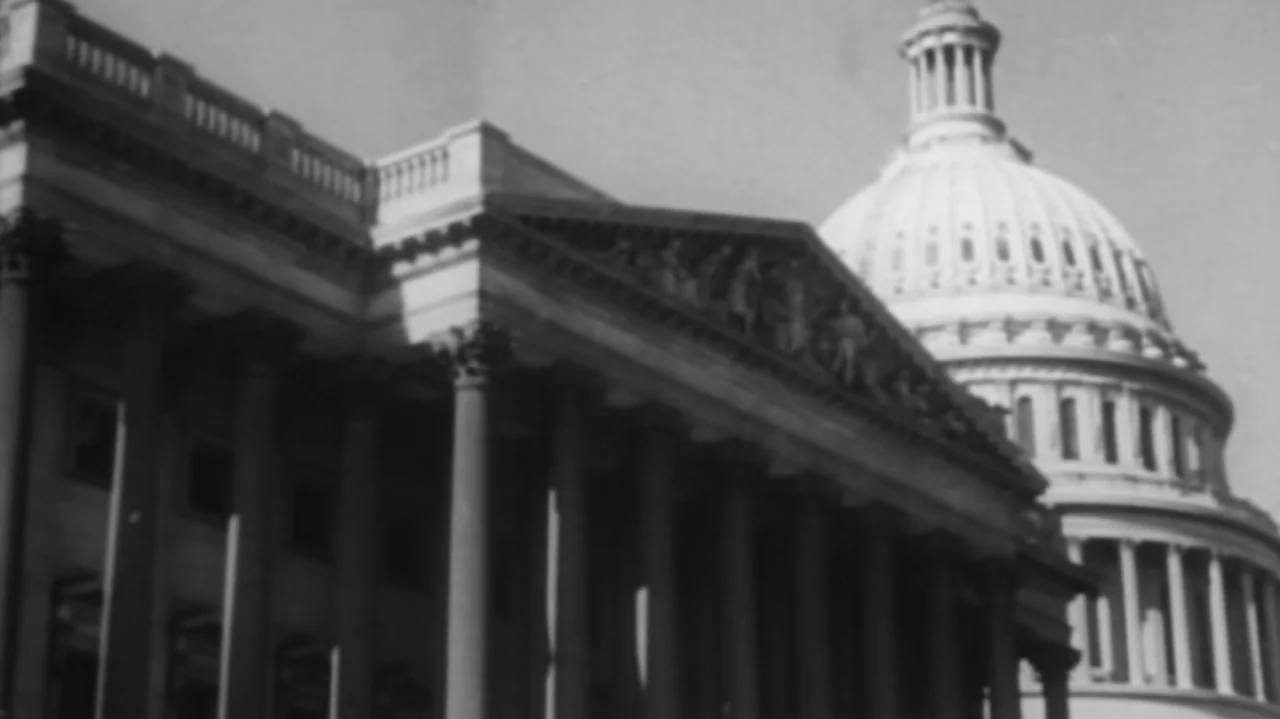 The Soul of America (2020) movie still: wide — The United States Capitol building is framed from a low angle exterior perspective. The white stone…