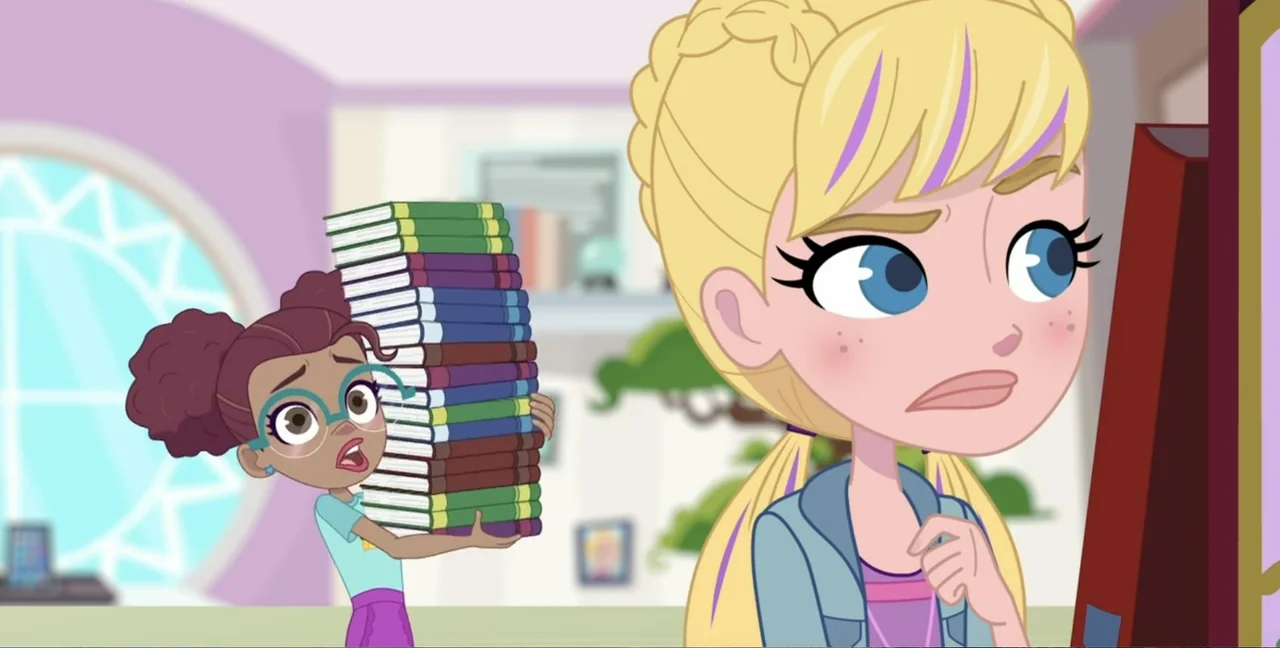 Polly Pocket Sparkle Cove Adventure (2023) movie still: medium — A light-colored room with books stored on shelves in the background. A small girl…