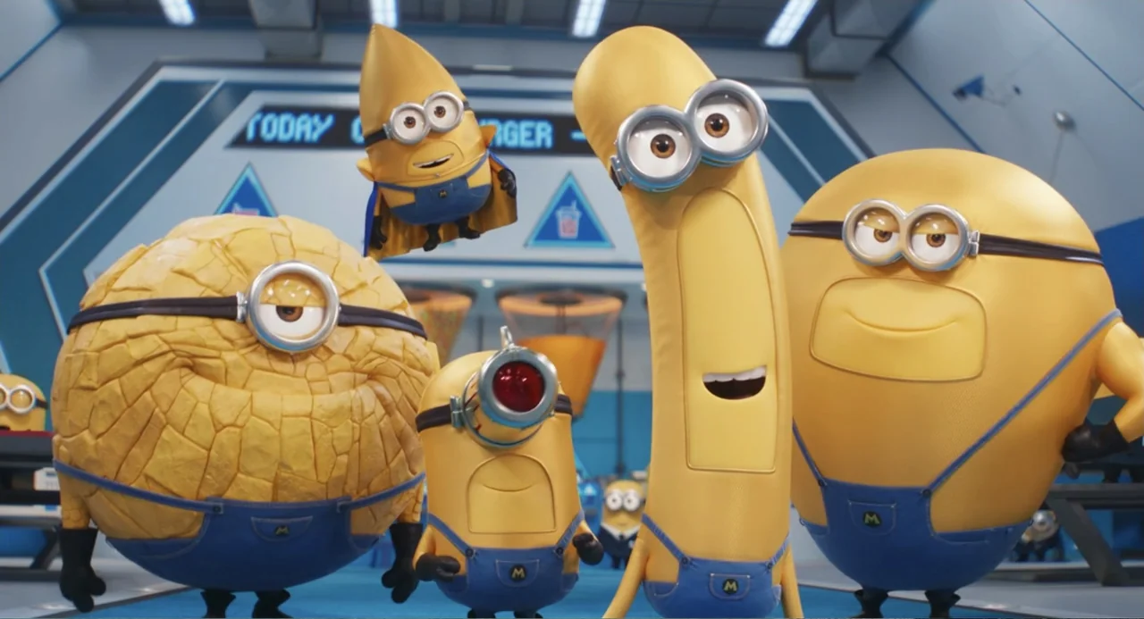 Despicable Me 4 (2024) movie still: medium — A high-tech laboratory interior features blue panels and illuminated display signs in the back. Five…