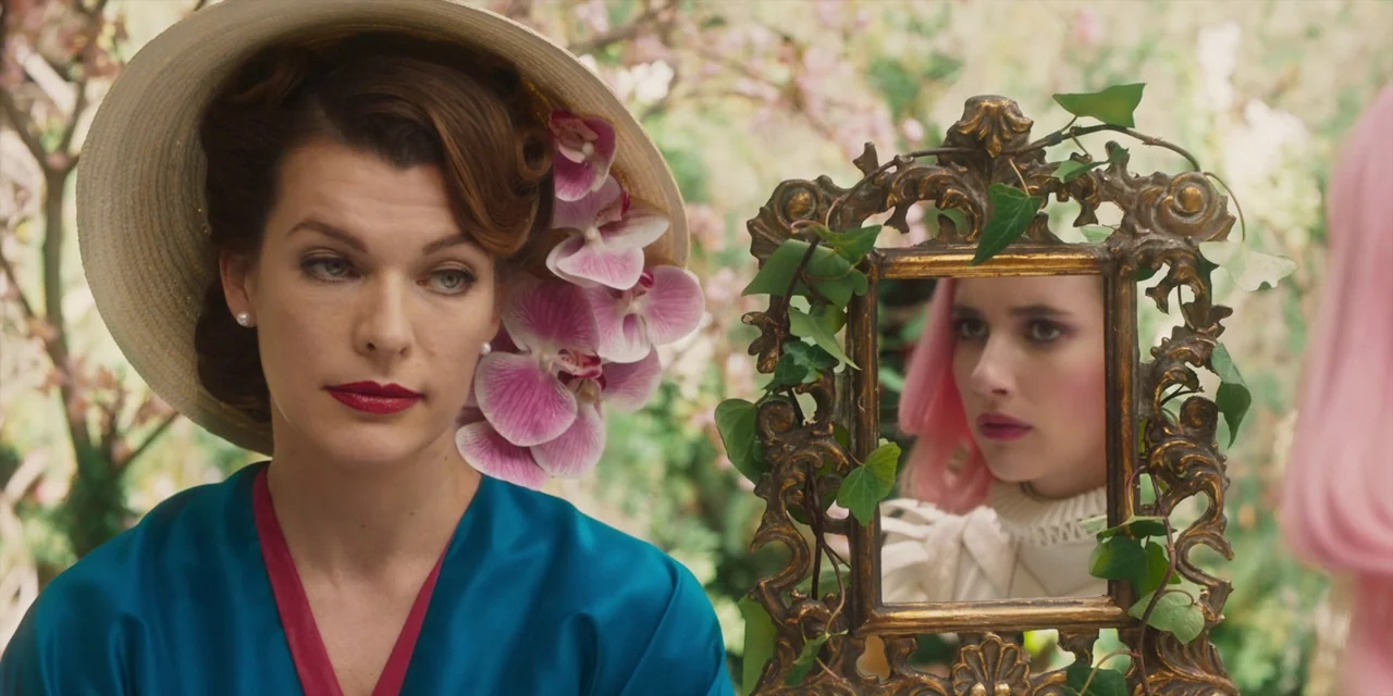 Paradise Hills (2019) movie still: medium — A woman stands in a lush outdoor garden while looking into a handheld mirror. The small antique gold…