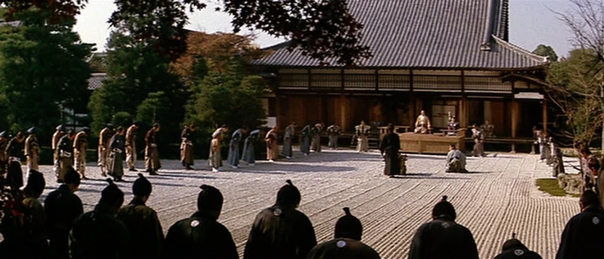 Lone Wolf and Cub: Baby Cart in Peril (1972) movie still: wide — A wide, meticulously raked gravel courtyard sits before a traditional wooden…