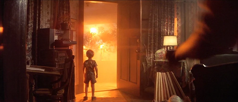 Close Encounters Of The Third Kind (1977) movie still: fullbody — A dimly lit home interior features patterned wallpaper, wooden furniture, and…