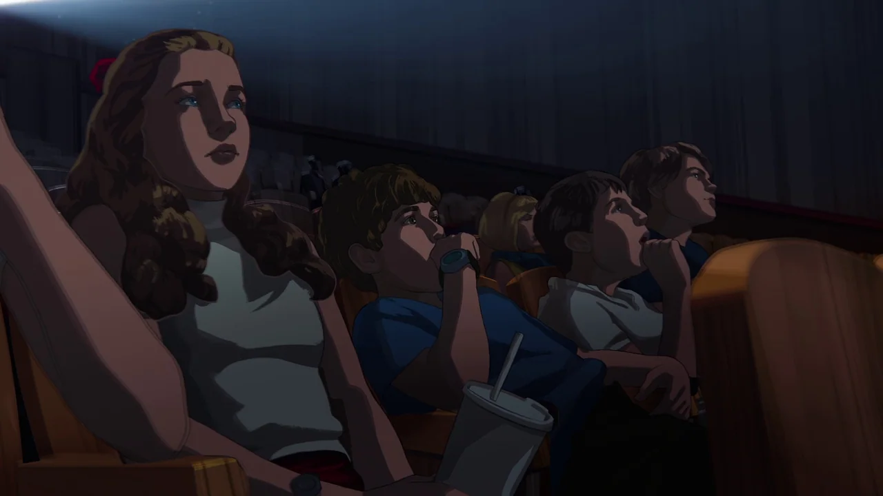 Apollo 10½: A Space Age Childhood (2022) movie still: medium — A dark movie theater interior with rows of empty seats behind the front viewers. A…
