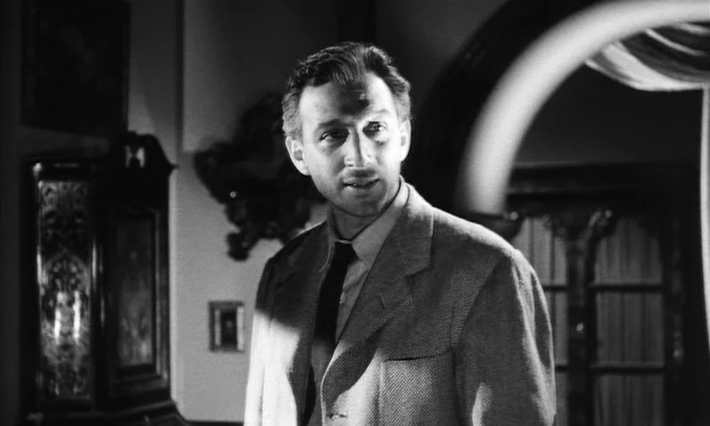 The Girl Who Knew Too Much (1963) movie still: medium — A dimly lit room within a traditional estate features ornate furniture and arched doorways.…