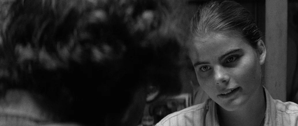 Manhattan (1979) movie still: closeup — A dimly lit interior space with soft, naturalistic illumination defining the subject's features. A young…
