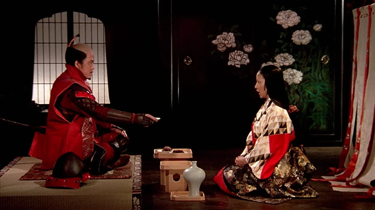 Ran (1985) movie still: medium — A traditional Japanese room features dark wood paneling with decorative painted peony floral motifs. A samurai and…