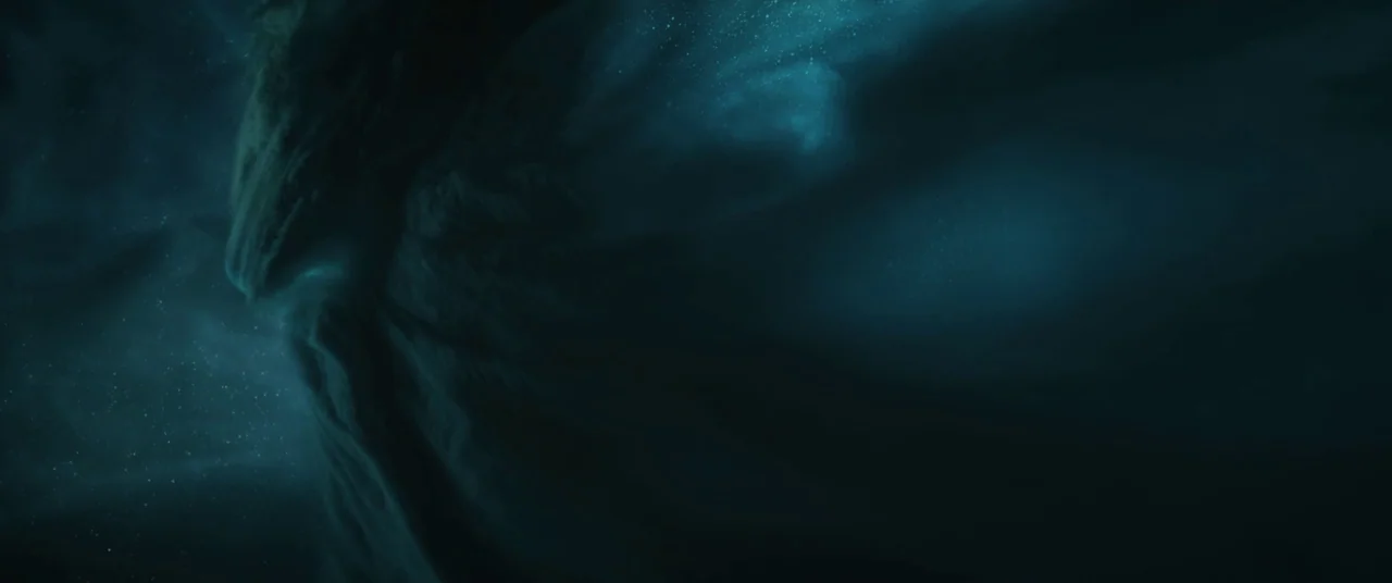 The Void (2016) movie still: establishing — Vast interstellar clouds of cosmic dust and gas illuminate a dark space environment. Subtle particles of…