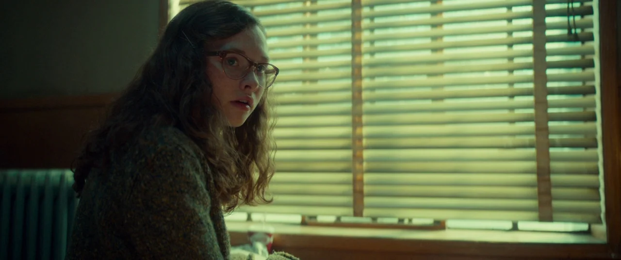 Scary Stories to Tell in the Dark (2019) movie still: medium — A interior space with a window covered by light-colored horizontal slatted blinds. A…