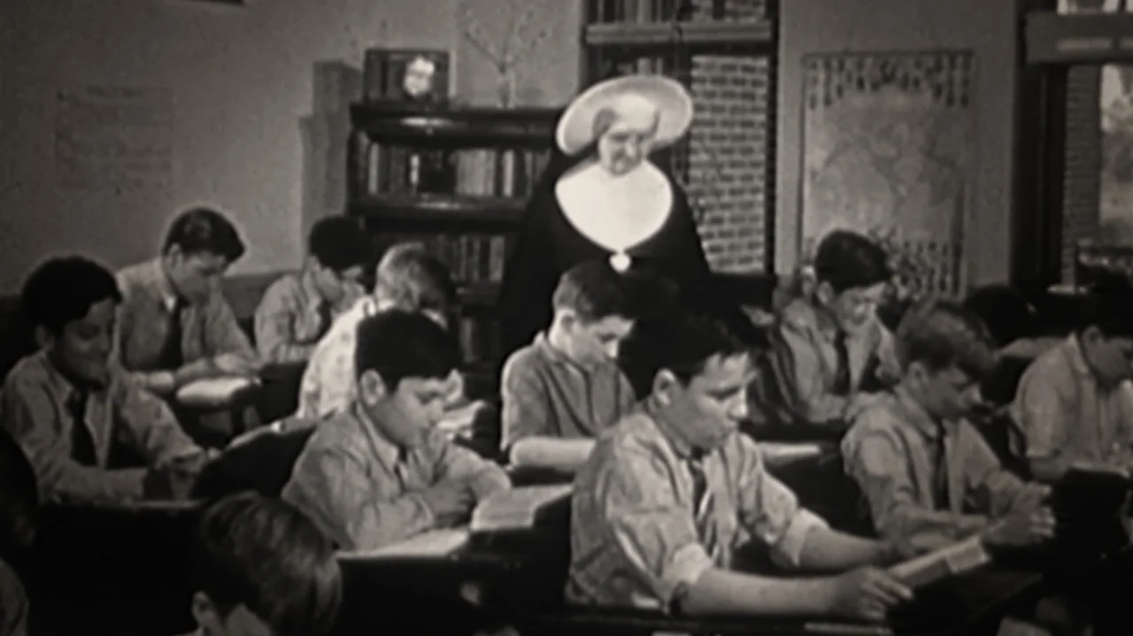 Breslin and Hamill: Deadline Artists (2018) movie still: medium — A 1950s school classroom features rows of wooden desks and a large wall map. A nun…