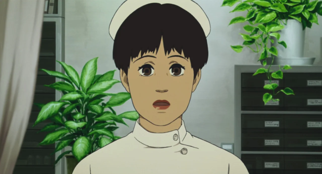 Tokyo Godfathers (2003) movie still: medium — An indoor medical station features white walls, filing cabinets, and two large potted plants. A young…