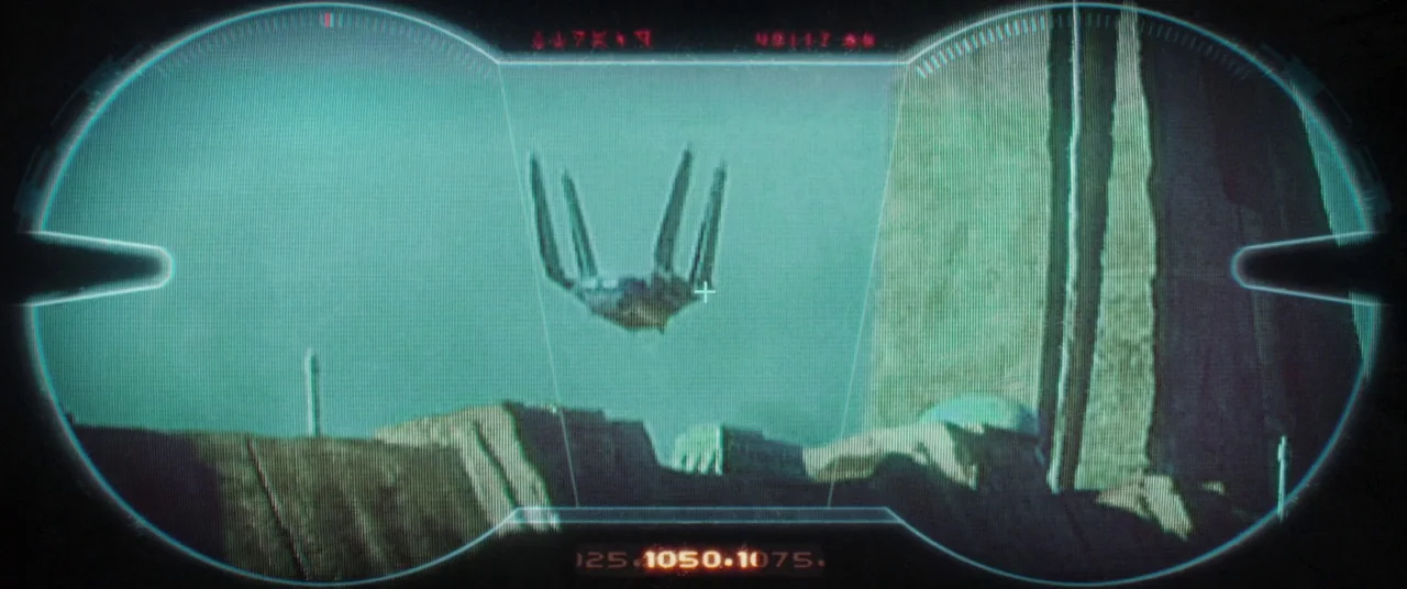 Rogue One: A Star Wars Story (2016) movie still: establishing — A barren, rugged alien landscape is visible through a digital targeting heads-up…