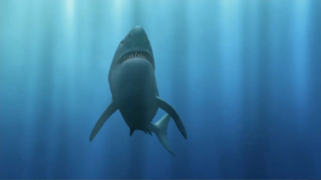 Megalodon: The Monster Shark Lives (2013) movie still: medium — A great white shark swims through clear blue ocean water under natural light. The…