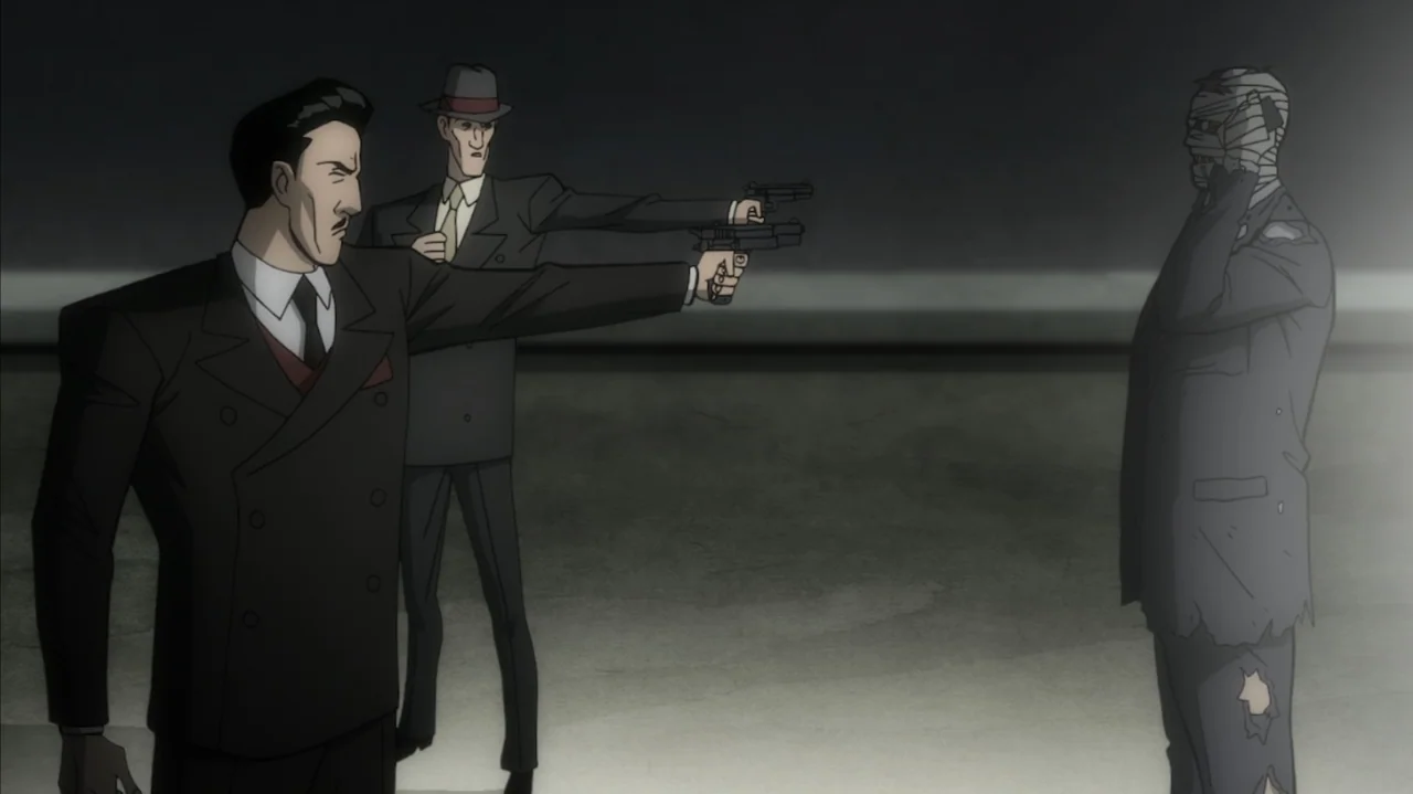 Batman: The Long Halloween, Part Two (2021) movie still: medium — An empty gray concrete surface serves as the backdrop for a confrontation between…