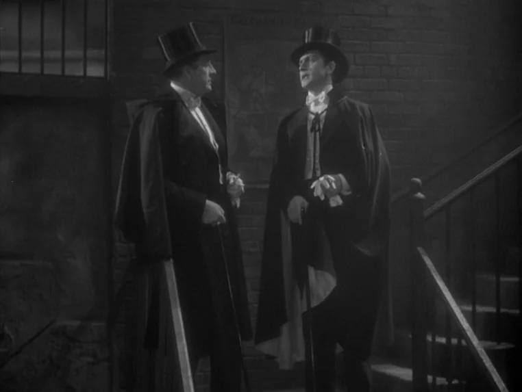 Dr. Jekyll and Mr. Hyde (1931) movie still: fullbody — An exterior masonry staircase features two men in formal evening wear and top hats. They…