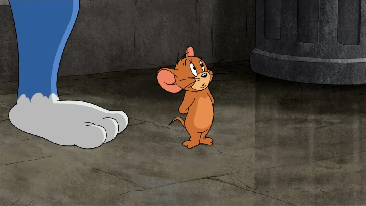 Tom and Jerry: Willy Wonka & the Chocolate Factory (2017) movie still: medium — An alleyway floor with a concrete texture and a metal trash bin…