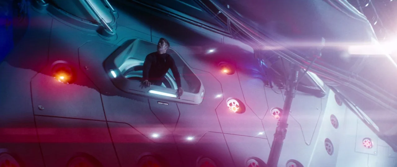 Star Trek Into Darkness (2013) movie still: wide — A curved white metallic wall features a central recessed window and multiple circular portals. A…