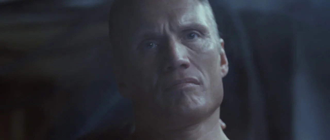 Universal Soldier: Regeneration (2009) movie still: closeup — A dark, nondescript room serves as the setting for this close-up shot. An older man…