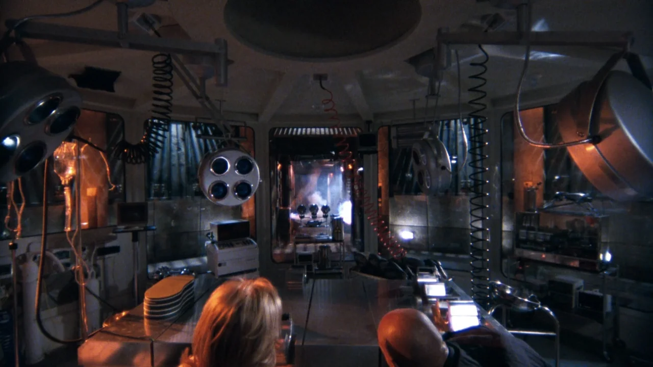 Mortal Kombat: Annihilation (1997) movie still: medium — A high-tech medical laboratory features suspended surgical lamps above a central metal…