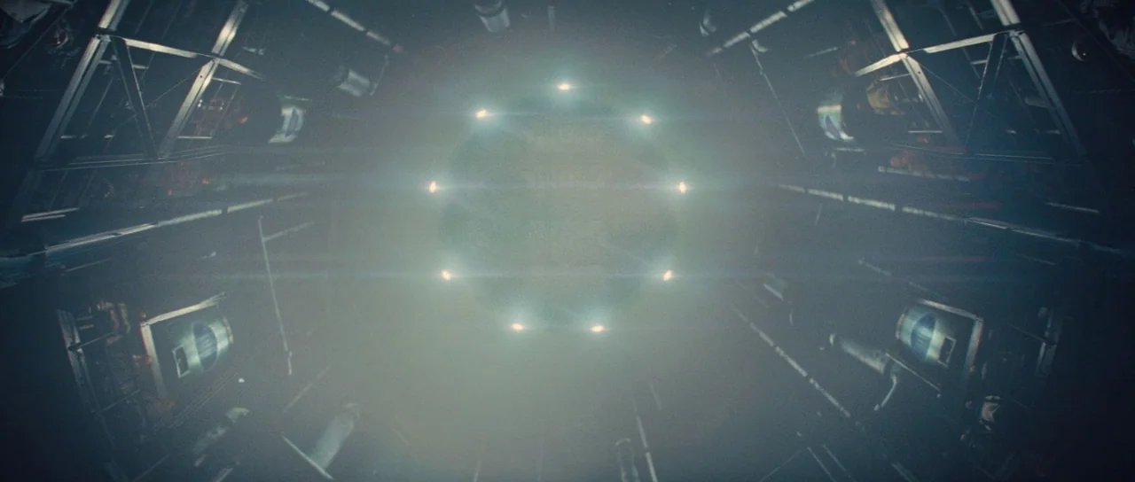 The World’s End (2013) movie still: establishing — A dark industrial corridor inside a spacecraft features metallic walls and structural steel…